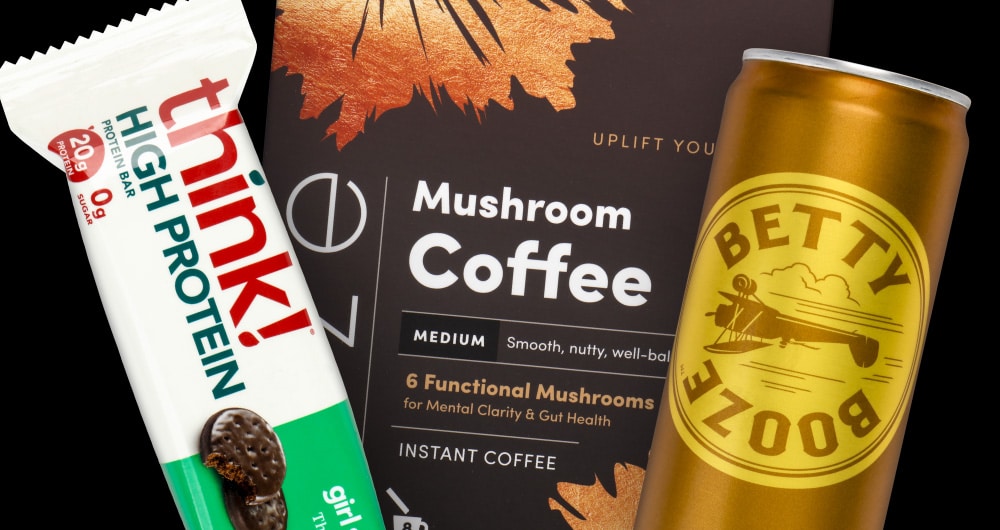 CPG product packaging samples including think! protein bar, mushroom coffee box, and Betty Booze can