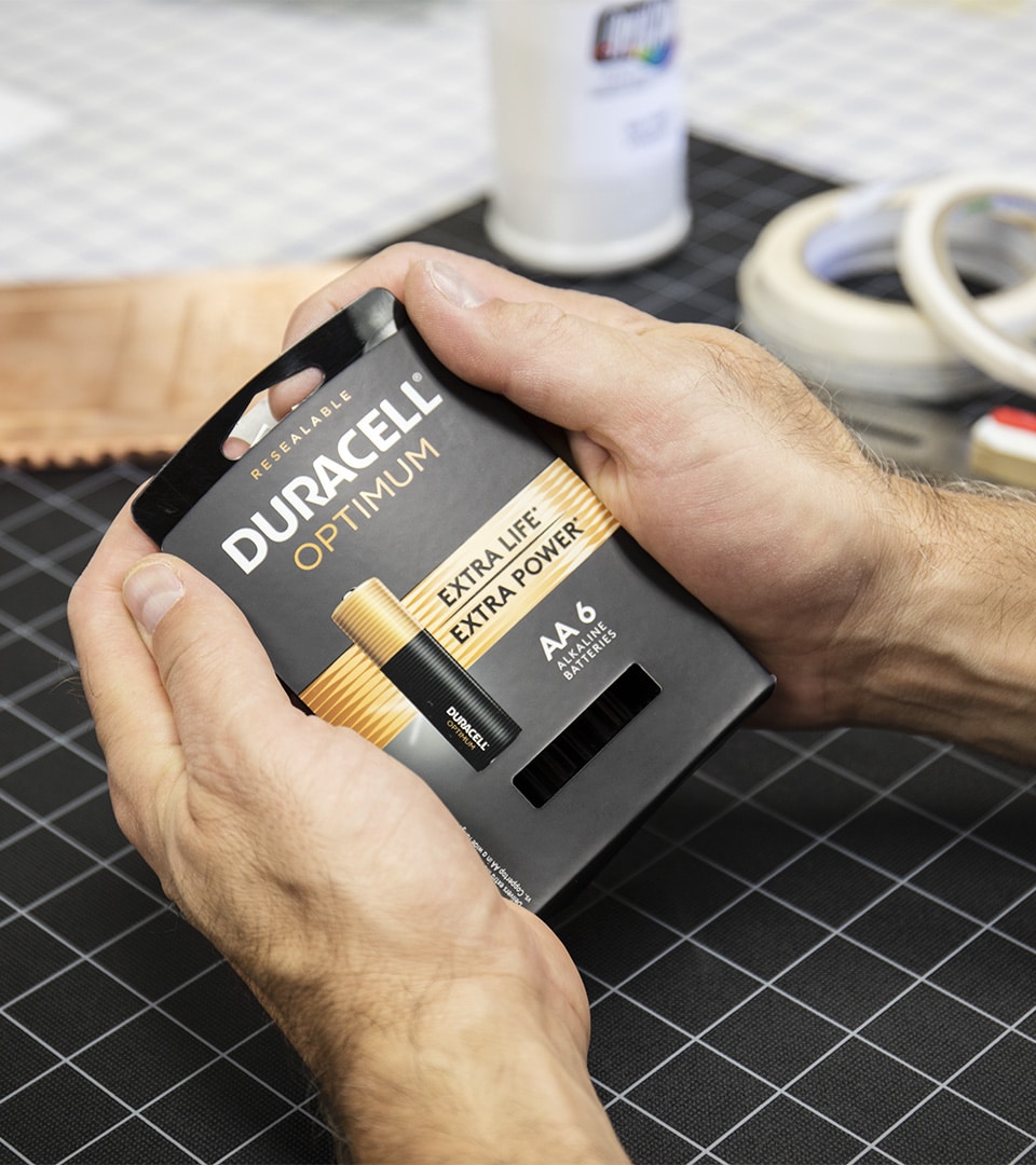 Duracell Optimum resealable battery packaging prototype held in hands at Kaleidoscope Chicago studio
