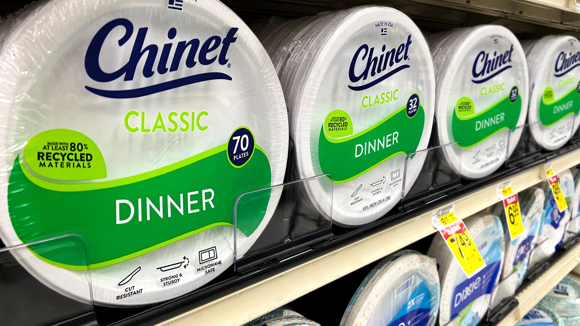 Chinet Classic Dinner paper plate packaging on retail shelf showing brand blocking against Dixie by Kaleidoscope