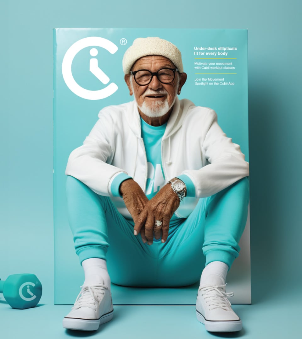 Cubii brand world lifestyle imagery showing older adult in teal wellness apparel seated in front of Cubii under-desk elliptical packaging by Kaleidoscope