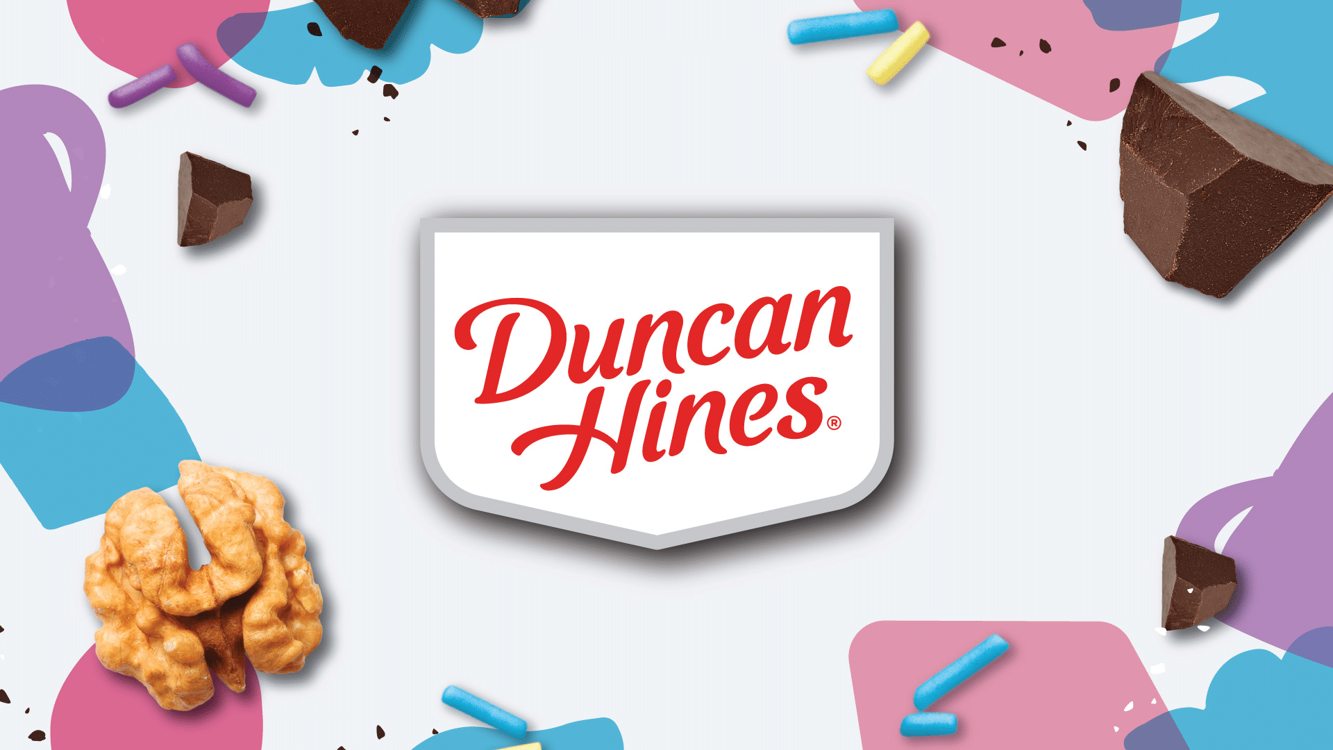 Duncan Hines brand identity logo on light background with keto flavor ingredient cues including sprinkles walnuts and chocolate by Kaleidoscope