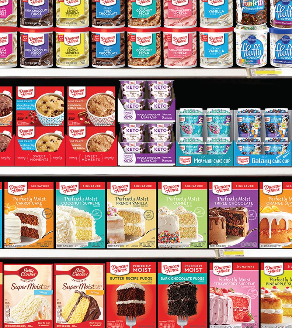 Duncan Hines Keto Friendly cake cup packaging design on retail shelf alongside Duncan Hines cake mix and mug cake product lines by Kaleidoscope