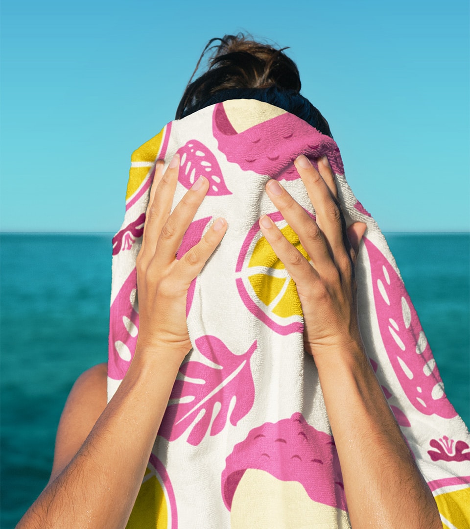 Kona Brewing Hard Seltzer beach towel lifestyle — brand world design by Kaleidoscope