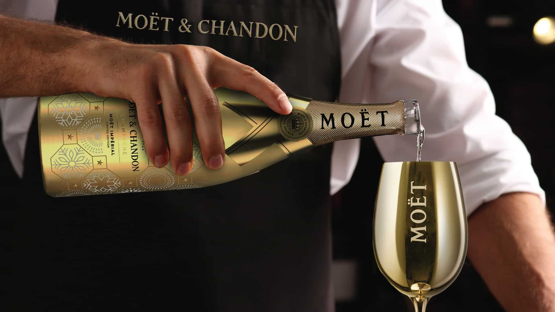 Moët & Chandon Impérial limited edition champagne being poured into branded gold glass by Kaleidoscope