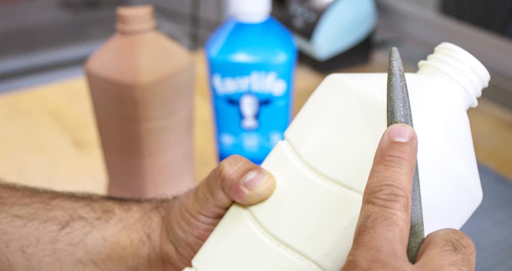 CPG bottle prototype being hand-finished by Kaleidoscope model maker, Chicago