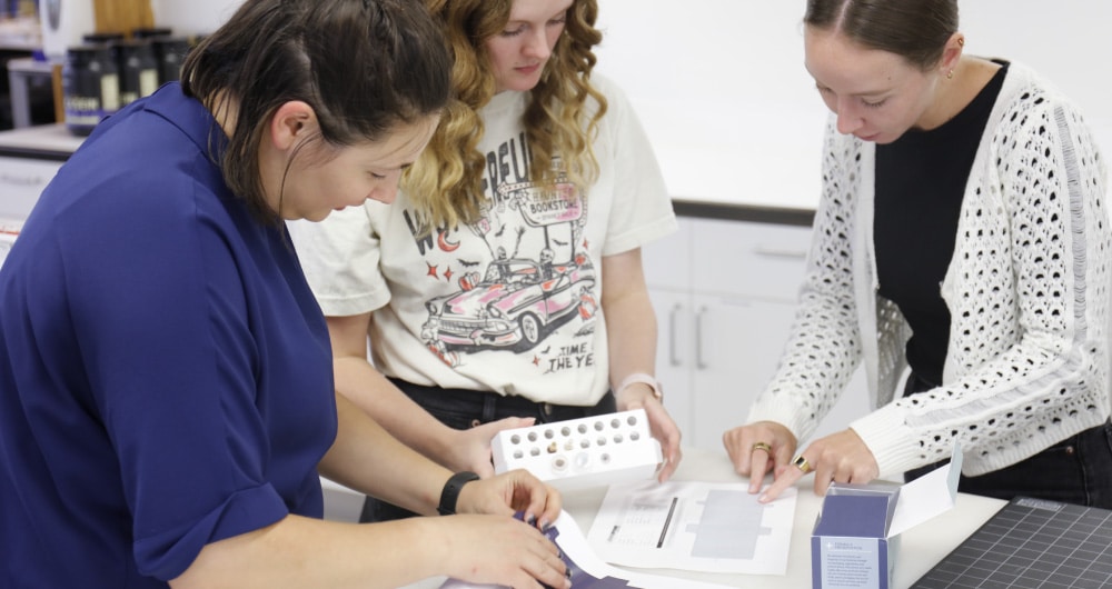 CPG innovation team reviewing early stage packaging prototypes at Kaleidoscope