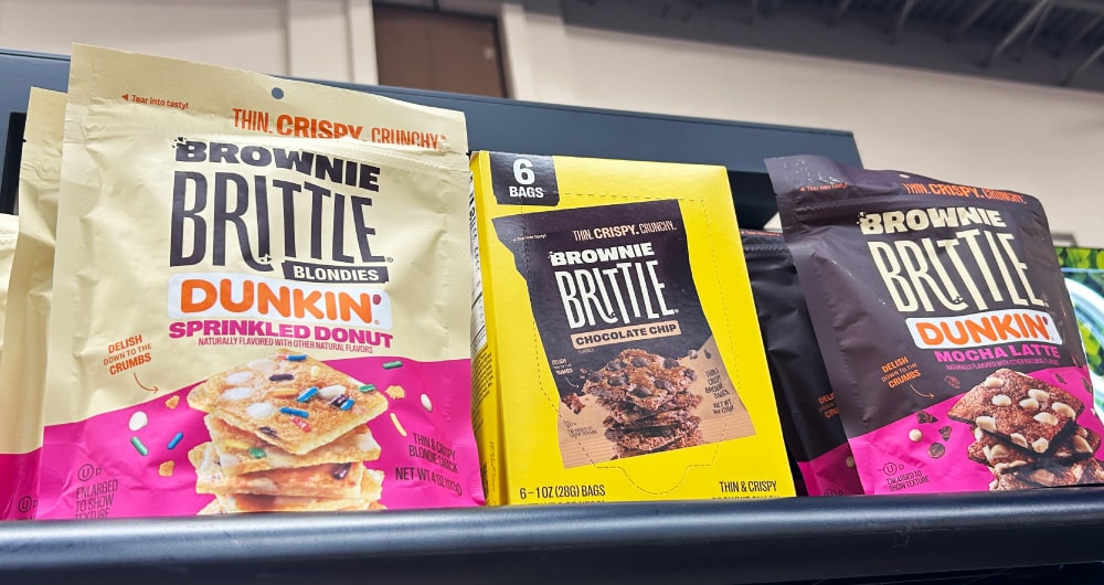 Brownie Brittle x Dunkin packaging lineup at Sweets and Snacks Expo 2026